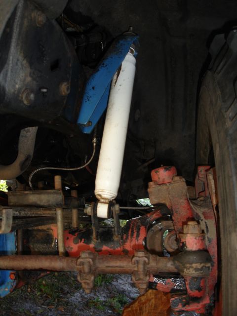 1989 Ford Bronco - Vehicle suspension components, including a shock absorber and linkage, are visible in this close-up shot.