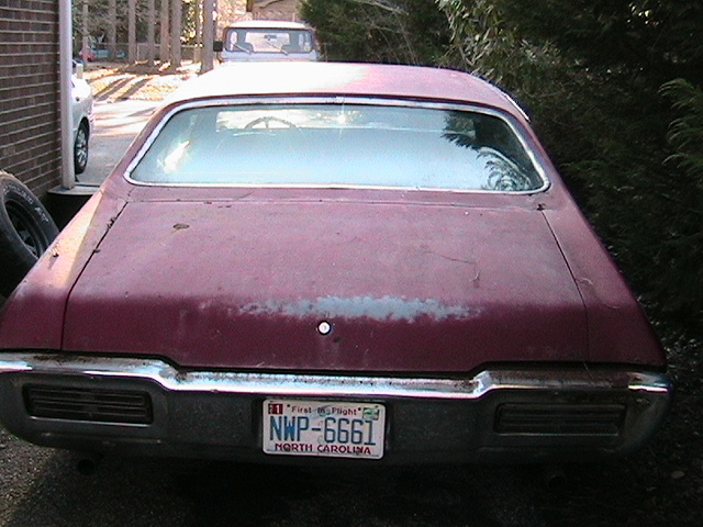 Maroon 1968 Pontiac Lemans rear view with North Carolina license plate NWP-6661