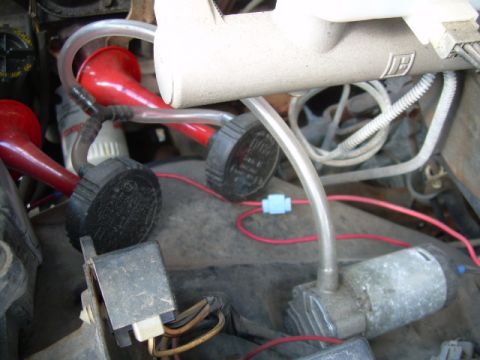 1988 Ford Bronco - Close-up view of air horns and their associated plumbing and electrical connections.