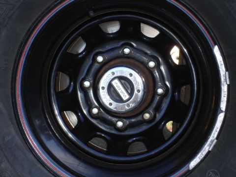 1989 Ford Bronco - Warn locking hub on a black wheel, likely for a 4x4 vehicle.