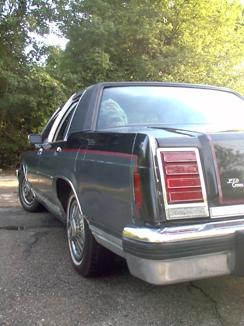 1987 Ford Crown Victoria LTD - Rear view of a 1987 Ford Crown Victoria LTD parked outdoors.