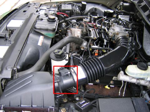 2000 Ford Crown Victoria - Engine bay view of a 2000 Ford Crown Victoria, with the mass airflow sensor clearly visible and highlighted.