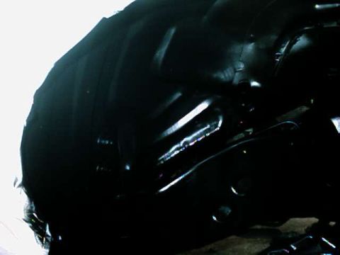 1976 Ford Ranchero - Underside view of a vehicle's wheel well and suspension components, showing dark metalwork.