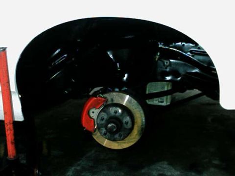 1976 Ford Ranchero - Close-up of a vehicle's rear brake assembly and wheel well.