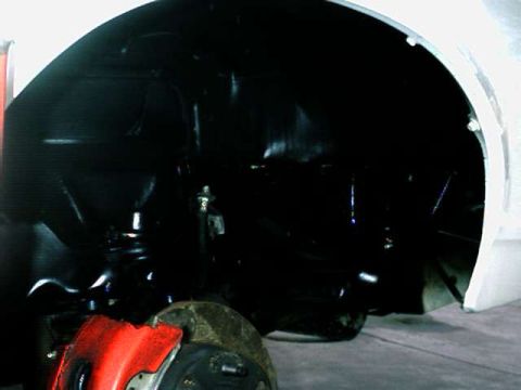 1976 Ford Ranchero - Focus on the wheel well and suspension components, not a full vehicle view.