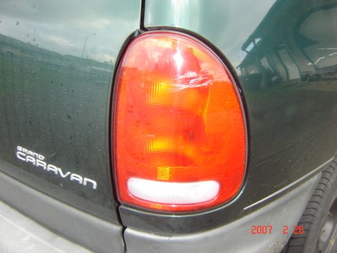 1997 Dodge Grand Caravan - The rear tail light of a Grand Caravan shows damage from an impact.