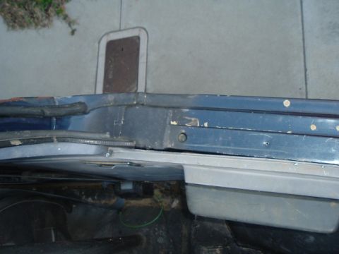 1989 Ford Bronco - Close-up view of a vehicle's door frame, revealing its construction and condition.
