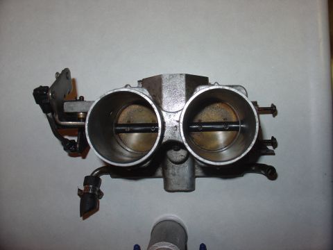 1988 Ford Bronco - Close-up of a dual throttle body, likely from a performance engine.
