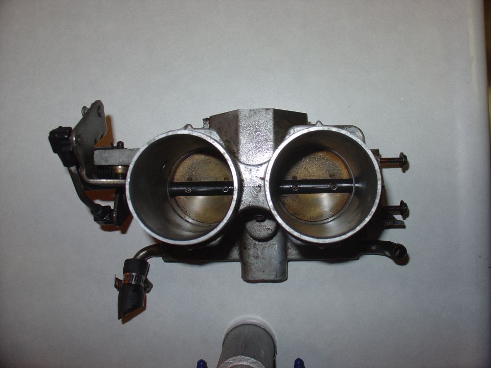 Dual throttle body assembly with two large openings and visible butterfly valves