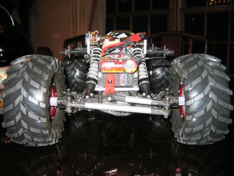 1985 Ford Bronco - This RC monster truck features oversized tires and a detailed suspension system, with visible electronic components.