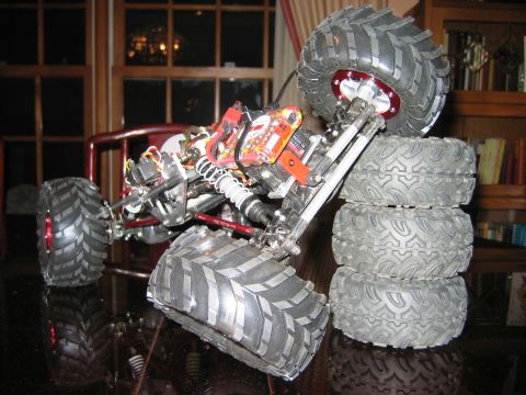 1985 Ford Bronco - The complex suspension and electronics of a radio-controlled monster truck are visible.