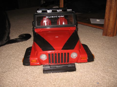 1990 Ford Bronco - This red toy Jeep features black racing stripes and 'RUBICON' text on the windshield.