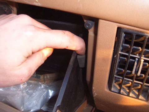 1988 Ford Bronco - Glove box interior of a 1988 Ford Bronco, showing the latch mechanism.
