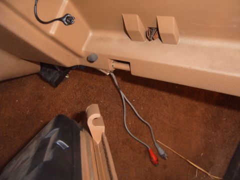 1988 Ford Bronco - Close-up view of the interior trim and wiring of a vehicle.