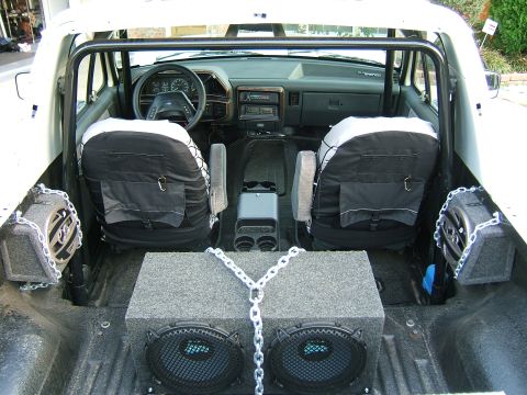 1991 Ford Bronco - Interior view of a 1991 Ford Bronco, custom speaker boxes and roll cage.