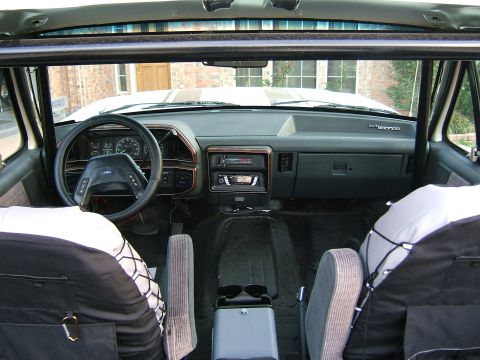 1991 Ford Bronco - Interior view of a 1991 Ford Bronco, the dashboard and front seats.
