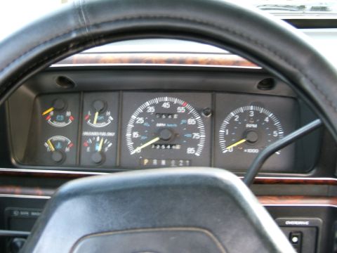 1991 Ford Bronco - The interior of a 1991 Ford Bronco displays its dashboard gauges and steering wheel.