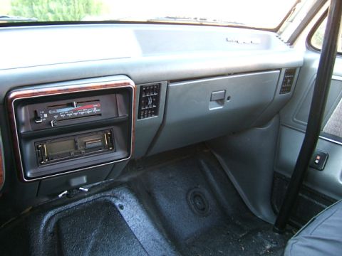 1991 Ford Bronco - The interior of a 1991 Ford Bronco displays its dashboard, complete with an aftermarket stereo and climate controls.