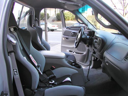 Interior view of a 2001 Ford F-150 Lightning with racing seats and harnesses