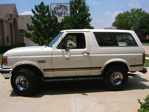1991 Ford Bronco - This 1991 Ford Bronco is parked in front of a house with a basketball hoop in the background.
