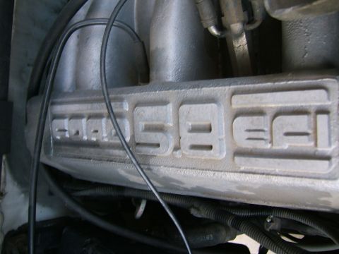 1991 Ford Bronco - The intake manifold clearly shows 'Ford 5.8 EFI' stamped into it.
