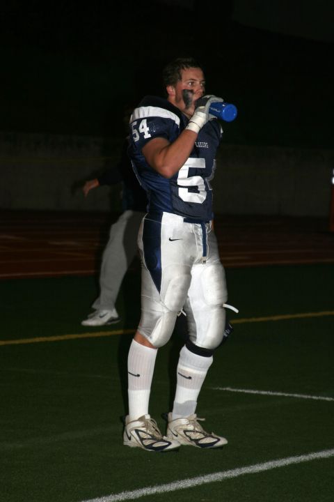 1993 Ford Bronco - A football player pauses during a game on a field, holding a drink.
