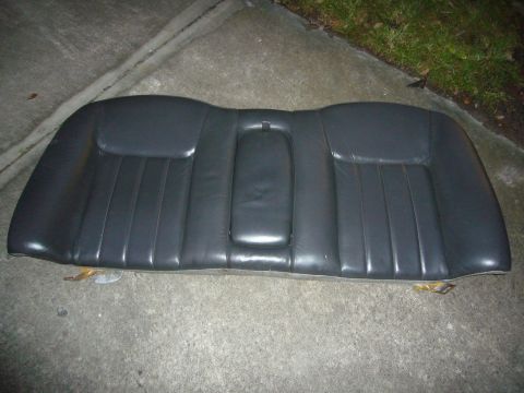 2000 Ford Crown Victoria - This is a car's rear seat, likely removed from a vehicle, shown outdoors on a concrete surface.