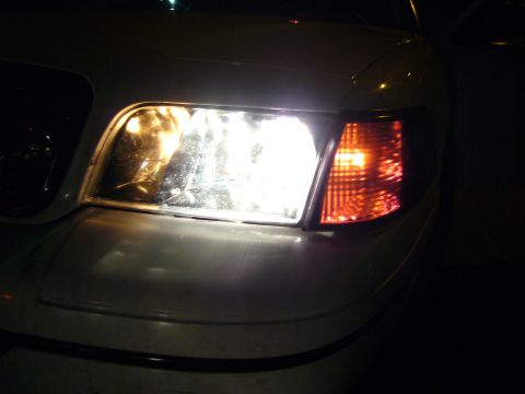 2000 Ford Crown Victoria - Front view of a 2000 Ford Crown Victoria's headlight and turn signal assembly.