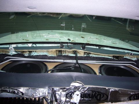 2000 Ford Crown Victoria - Custom subwoofer installation in a car interior, with sound dampening material and wiring visible.