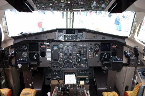 2003 Ford Crown Victoria - View from inside an airplane cockpit, showing the complex instrument panel and controls.