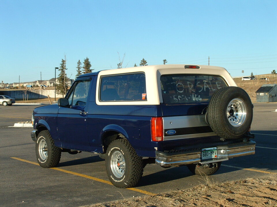1993 Ford Bronco Eddie Bauer parked, "FOR SALE" written on rear window