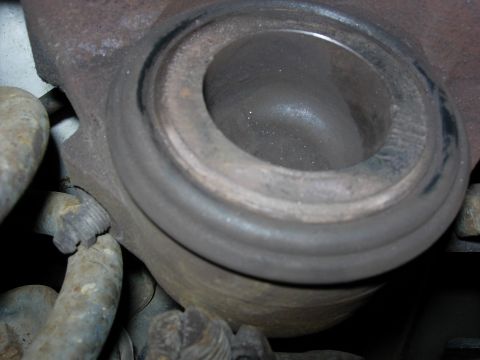 1990 Ford Bronco - Drivers side caliper piston has some maring but overall good condition. Rubber seal still soft and functional.