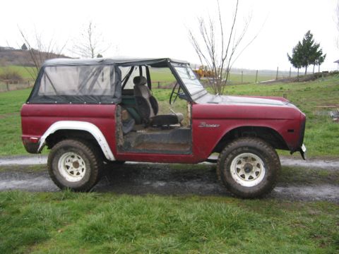 1968 Ford Bronco - This 1968 Ford Bronco features a soft top and is shown from the side.