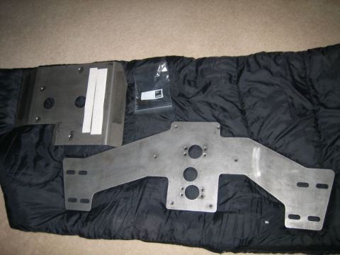 1986 Ford F-150 - Unidentified metal parts and hardware are displayed on a black sleeping bag.