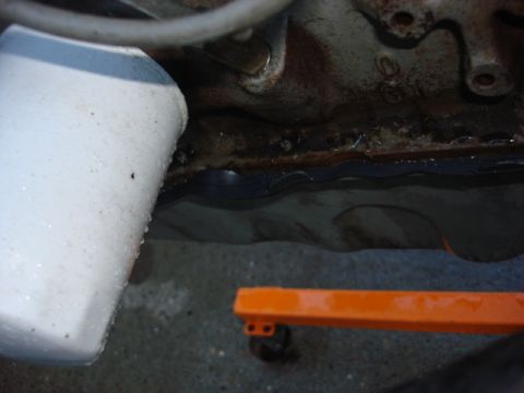 1983 Ford Bronco - if you look under the oil filter you can see the pan gasket sticking out all over.