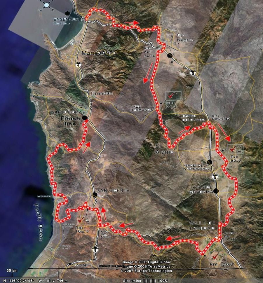Satellite map showing a red dotted line route with arrows, indicating a race course through a desert landscape with towns like Ensenada and San Quintin labeled