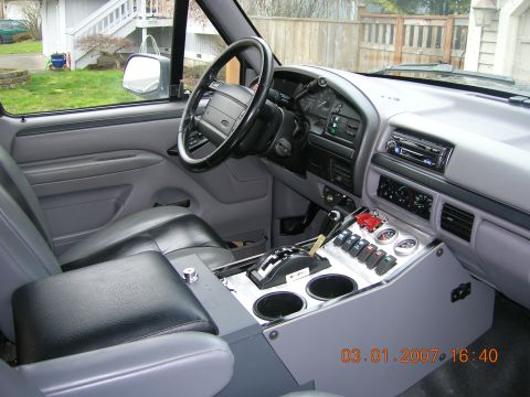 1996 Ford Bronco - Interior view of a 1992 Ford F-Series truck, a custom center console and gray upholstery.