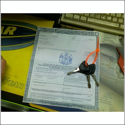 1977 Ford F-150 - A Wisconsin Certificate of Title for a Vehicle is shown with keys attached by an orange zip tie.