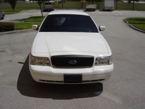 2000 Ford Crown Victoria - Front view of a white 2000 Ford Crown Victoria parked in a lot.