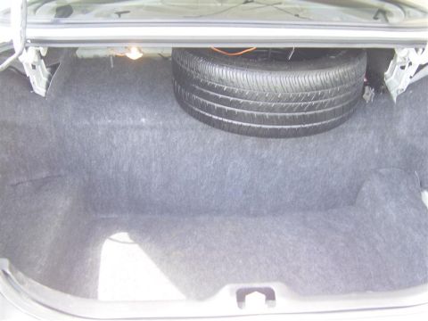 2000 Ford Crown Victoria - The spare tire is visible in the trunk of the car.