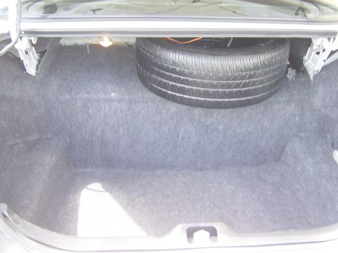 2000 Ford Crown Victoria - The spare tire is visible in the trunk of the vehicle.