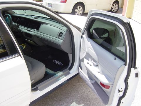 2000 Ford Crown Victoria - Interior view of a 2000 Ford Crown Victoria, with a second vehicle visible in the background.