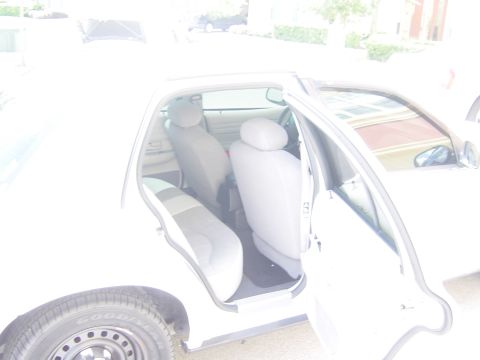 2000 Ford Crown Victoria - The interior of a 2000 Ford Crown Victoria, viewed from the passenger side with doors open.