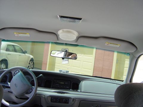 2000 Ford Crown Victoria - Interior view of a 2000 Ford Crown Victoria, showing the dashboard and steering wheel.