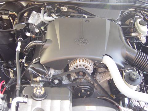 2000 Ford Crown Victoria - Close-up of a Ford 4.6L V8 engine, showing the alternator and drive belts.