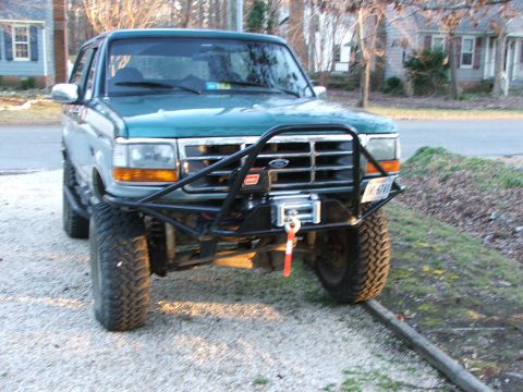 1996 Ford Bronco - This 1996 Ford Bronco features a custom front bumper with an integrated winch and off-road tires.
