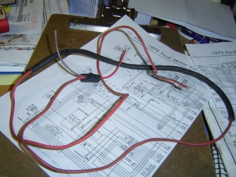 1979 Ford Bronco - Wiring harness and 1979 Ford Motor Co. electrical diagrams are on a clipboard.