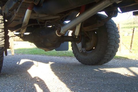 1994 Ford F-150 - Underside view of a 1994 Ford F-150, focusing on the rear axle and suspension components.