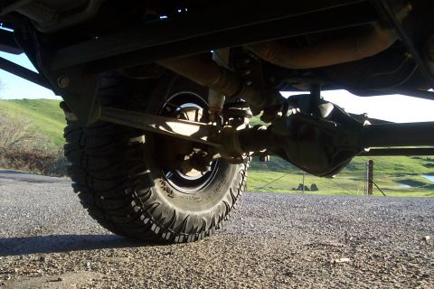 1994 Ford F-150 - Close-up view of the rear axle and suspension components of a truck.
