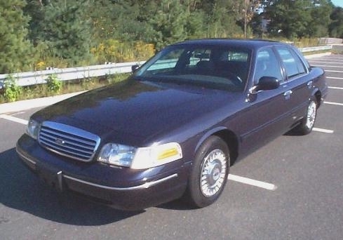 Dark blue 1999 Ford Crown Victoria sedan, 3/4 front view